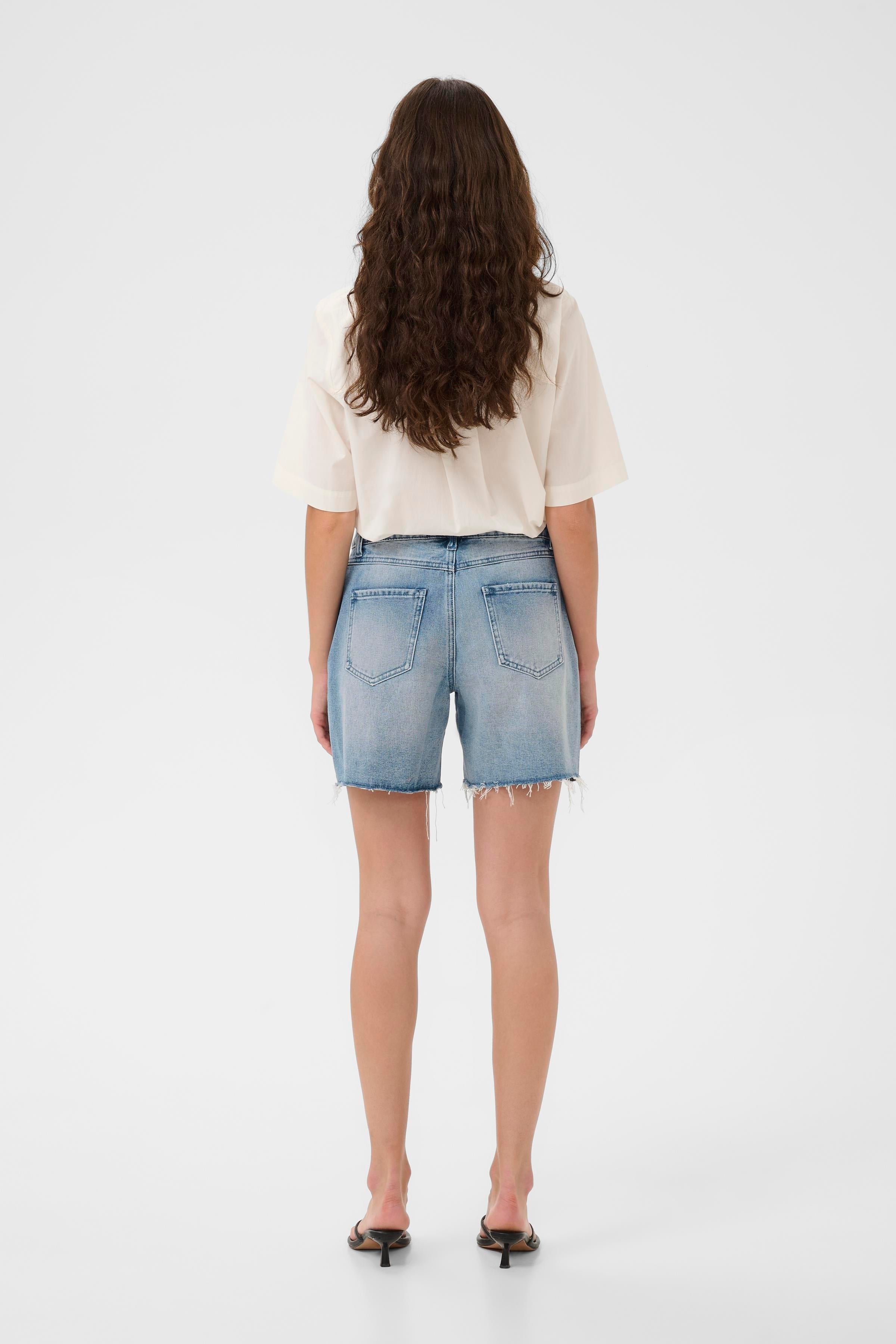 Jutea gallastuttbuxur frá Culture - Light Blue Wash gallaefni